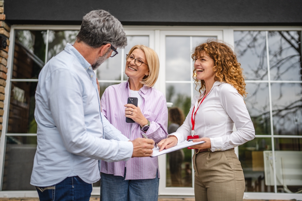 AMW Construction And Roofing Insurance Agent Discussing With Happy Clients